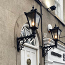 Victorian traditional cast iron wall light 1.1m in height with decorative arm.