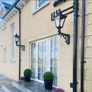 Victorian traditional cast iron wall light 0.97m in height with decorative arm.