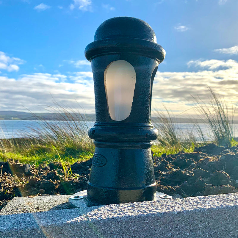 Decorative bollard light in cast iron with a frosted lens 0.43m in height.