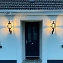 Victorian globe wall light in cast iron 0.59m in height with decorative arm.