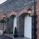 Victorian traditional cast iron wall light 0.97m in height with decorative arm.